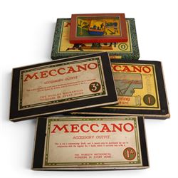 Early 20th century Meccano outfits, comprising 'Engineering in Miniature' set no. 1, 'Engineering for Boys' set no. 0, Accessory Outfit no. 1A, Accessory Outfit no. 3A and one other