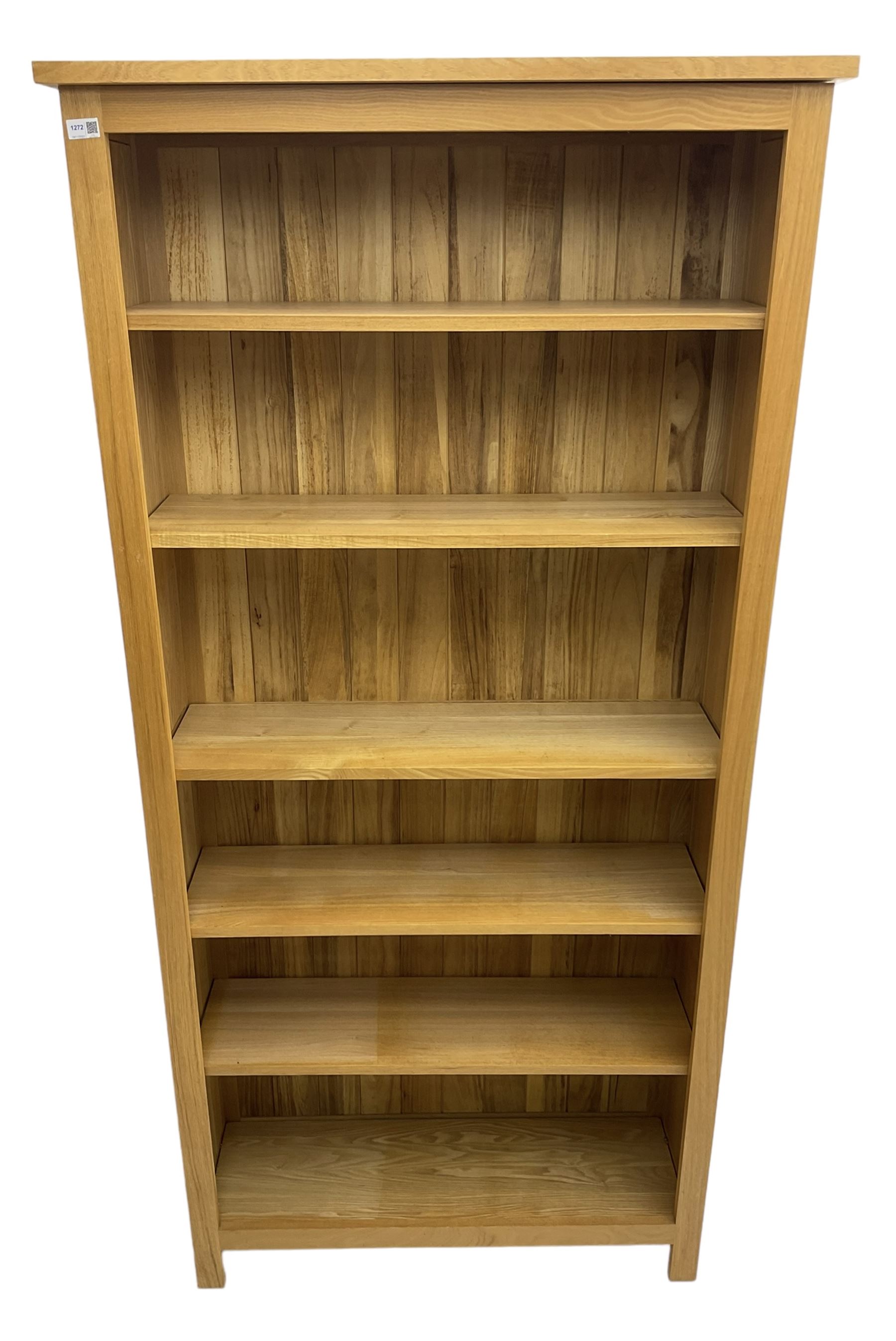 Contemporary light oak open bookcase, fitted with five adjustable shelves