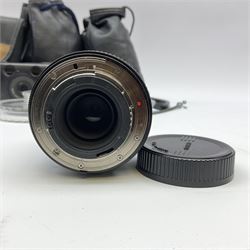 Nikon FM 35mm SLR camera body, Sigma 28-300mm 1:3.5-6.3 lens, Cosina 100mm 1:3.5 macro lens, two macro adaptors, instruction manual, Nikon 'Lite-Touch zoom' 35mm camera, and three relating carrying cases