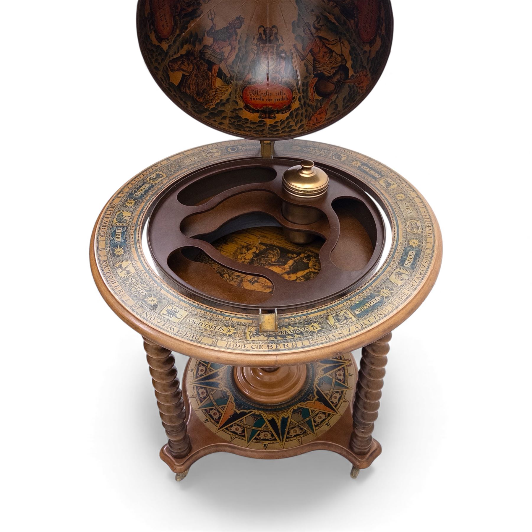 20th century Italian reproduction globe drinks table, the cartographic sphere decorated with Renaissance-style map scenes, hinged upper section enclosing bottle storage, with printed zodiac and calendar ring to the top, on spiral-turned legs joined by a compass rose undertier, brass castors below