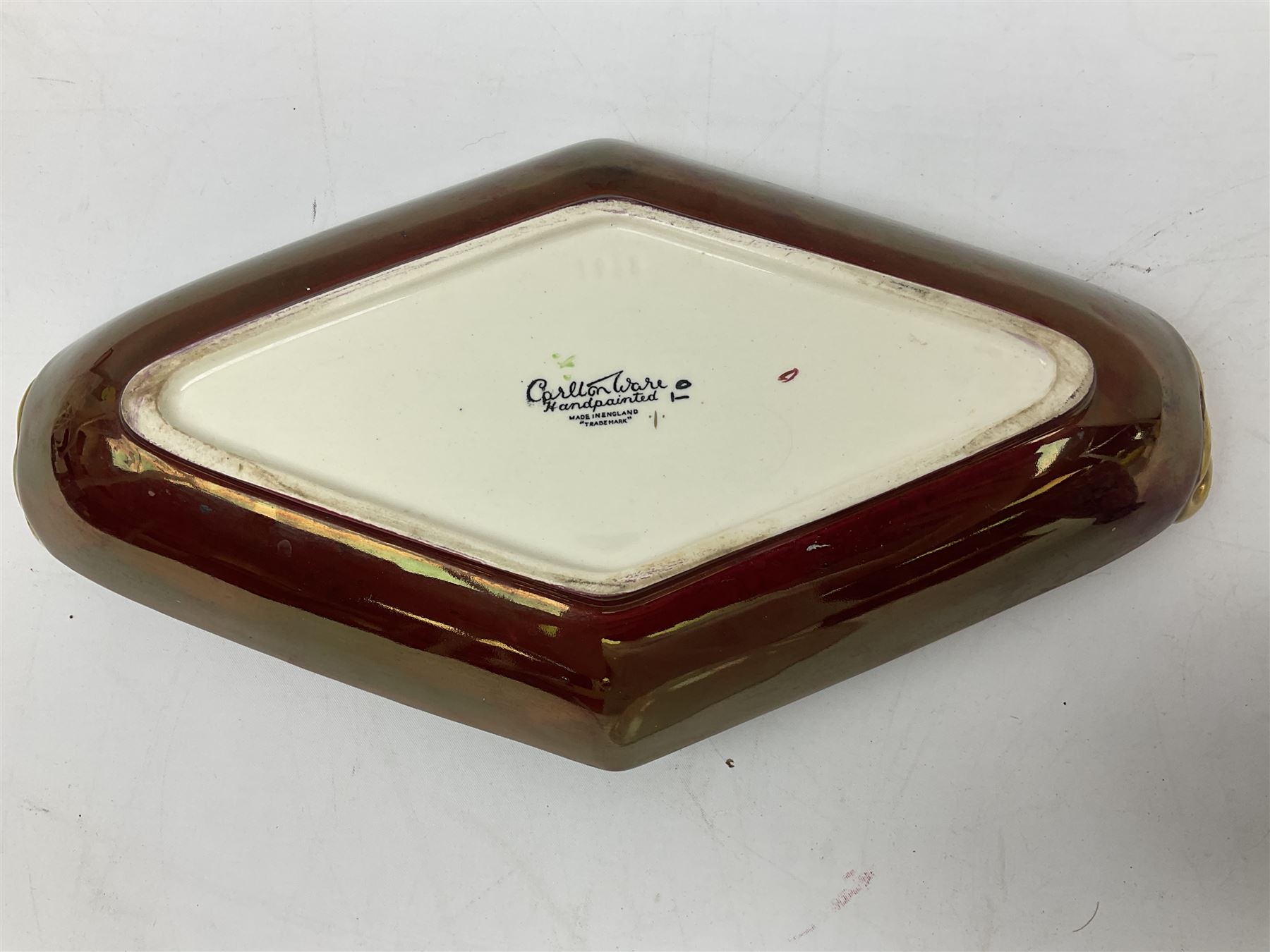 Shelley Cloisonne pattern vase, Carlton Ware Rouge Royal pattern twin handed dish and ash tray decorated with pagoda and Poole Delphis shallow bowl with geometric decoration on orange ground, largest L28cm
