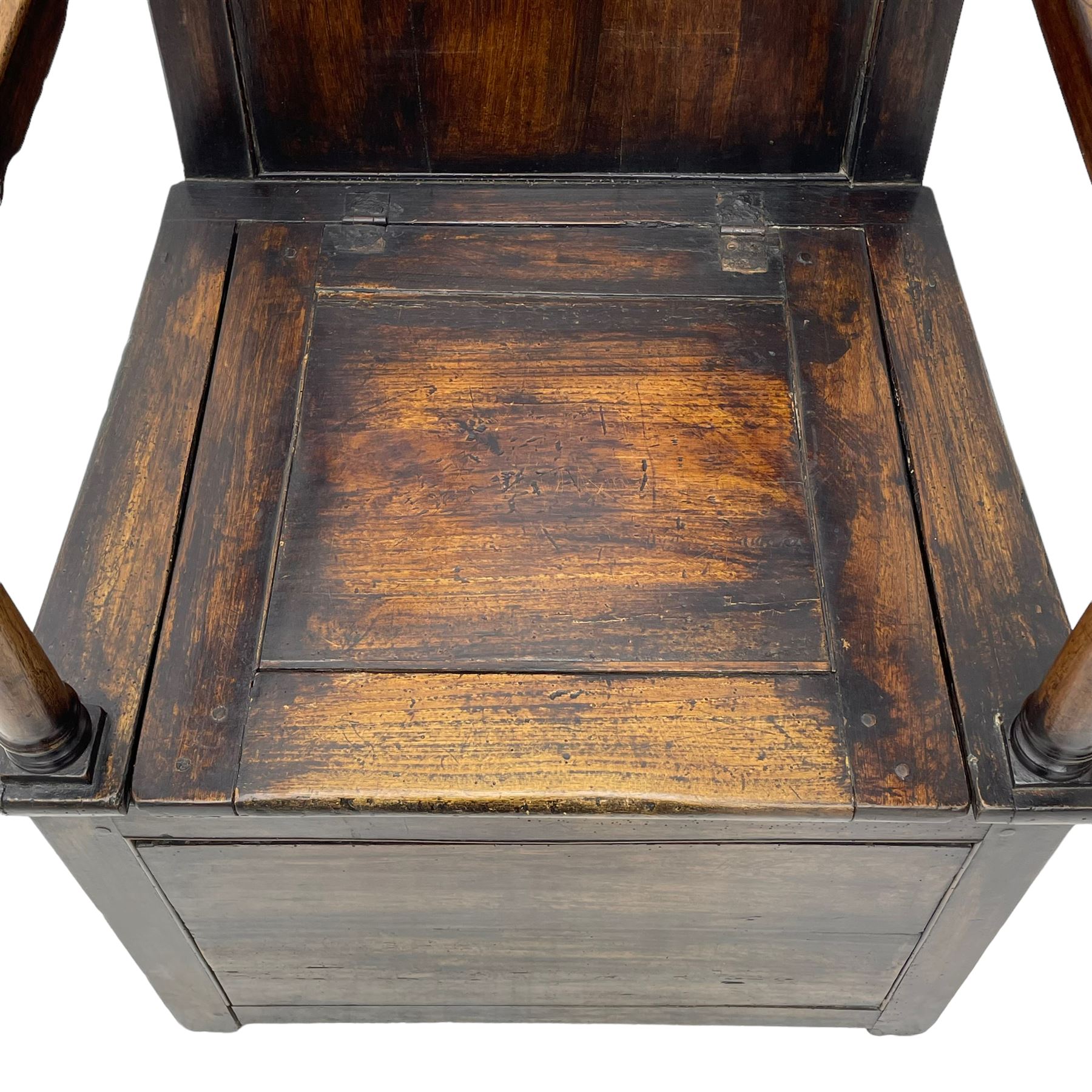 18th century elm box-seat lambing chair, dished cresting rail over panelled back, panelled hinged lid flanked by two turned arm supports