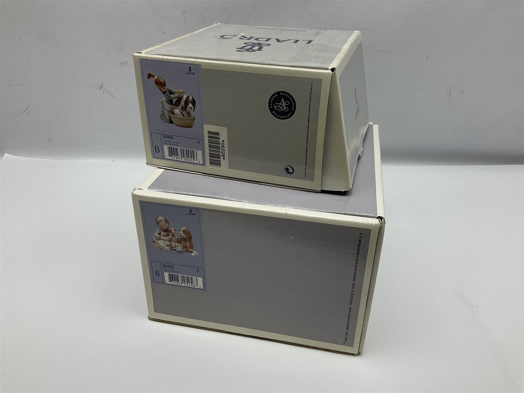 Pair of Lladro figures comprising 'Mis Amigos' model no 5456, and 'Bashful Bather' model no 5455, both with boxes