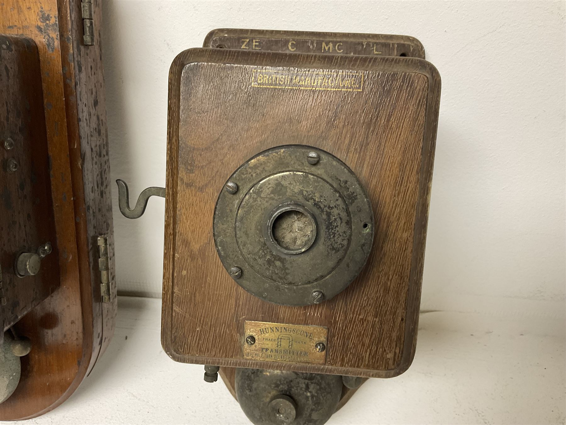 Two Hunningscone patent wall mounting telephones in walnut casing, together with Sterling Telephone & Electric Co. Ltd early wall-mounted telephone 'Primax' and one other 
