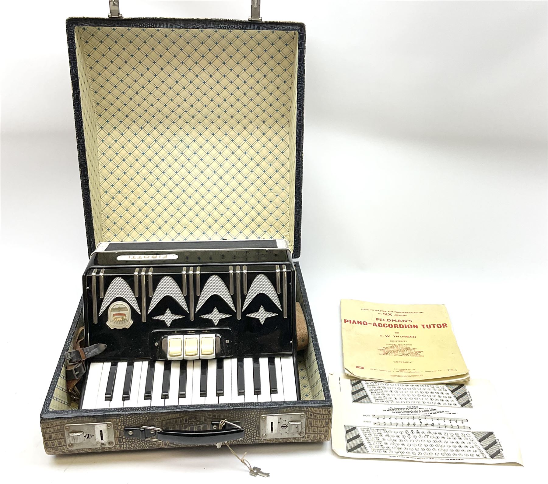 GDR Firotti piano accordion with black and silver case, sixteen keys and forty-eight buttons L38cm; in simulated reptile skin case with sheet music