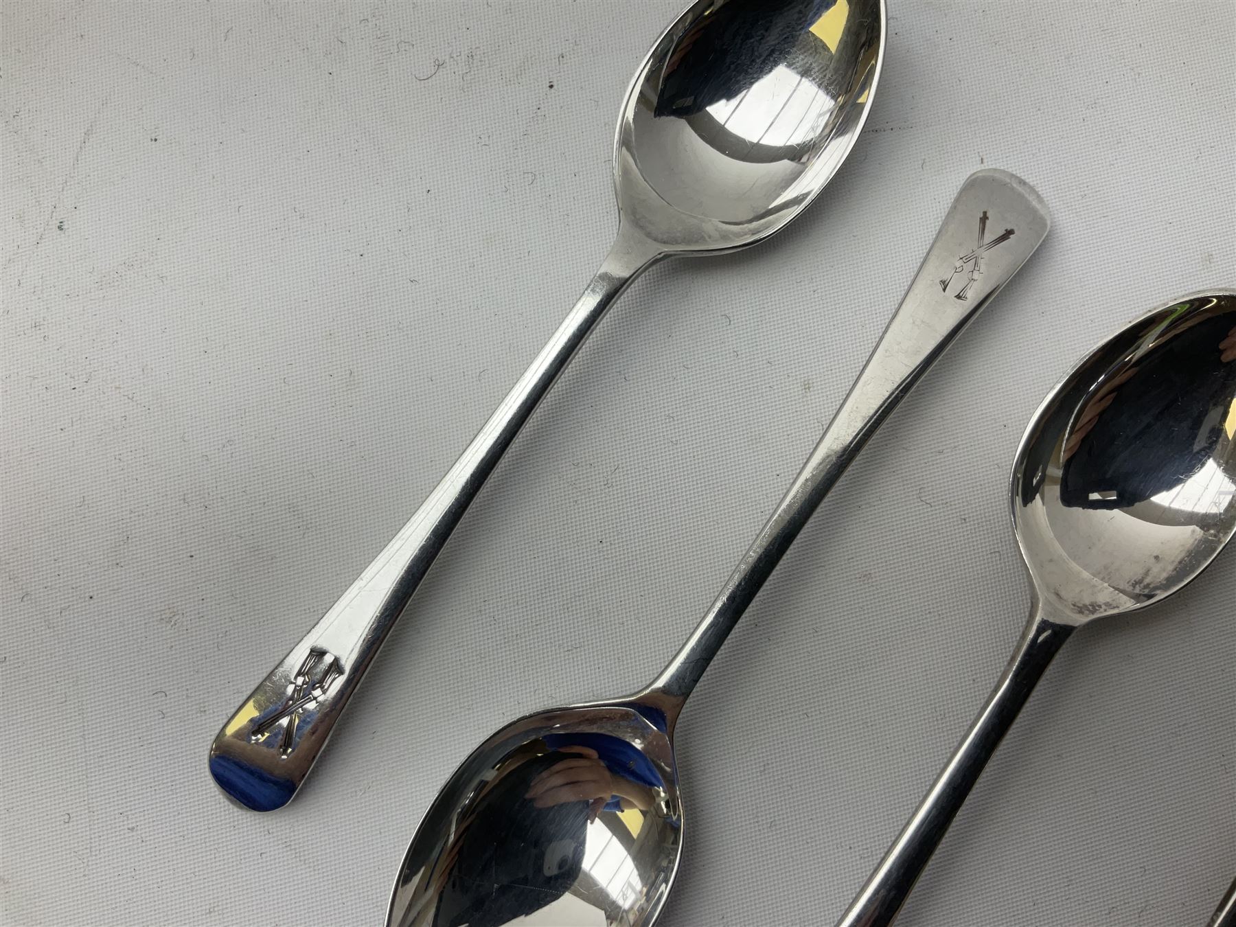 Set of three Yorkshire Miniature Rifle Association hallmarked silver and enamel fob medals, Birmingham 1925, 1926 & 1929; together with six silver plated coffee spoons each engraved with crossed rifles to the terminal (9)