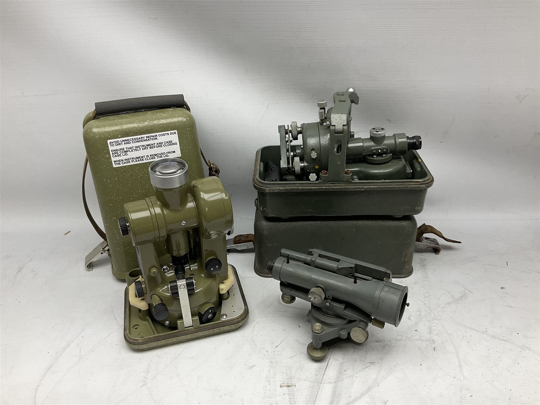Swiss Kern K1-RA engineer's self-reducing tachymeter theodolite, serial no.197914, with metal cover; Hilger & Watts Ltd. theodolite, serial no.114671, with tool set and metal over; Cooke Troughton & Simms Ltd. tilting level, serial no.SO377O3; uncased; and mahogany hinged  measuring staff (4)
