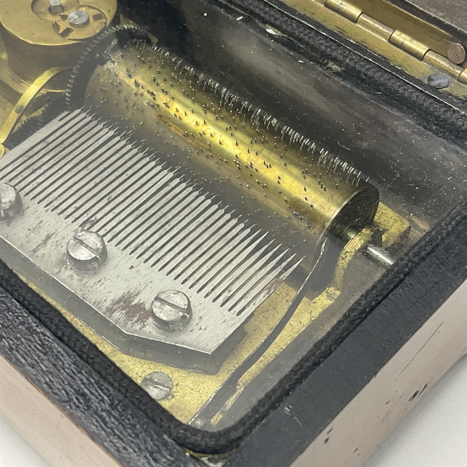 Small late 19th/early 20th century Swiss walnut cased musical box, the overglazed movement with 5cm cylinder and thirty-five tooth comb; the lid with card inscribed 'La Fauvette Salse' and 'Marche de Faust'; under base winding with key; serial no.50443, L12cm