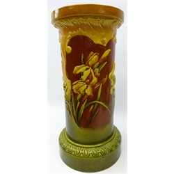  Late Victorian Bretby jardiniere stand of cylindrical form, with reserve panels painted with iris' within a scroll moulded frame, impressed no. 800, H64cm    