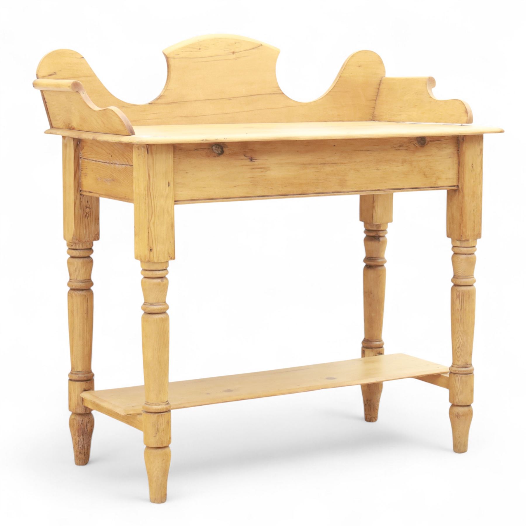 20th century pine washstand, shaped three-quarter gallery back over rectangular top, raised on turned supports with lower undertier