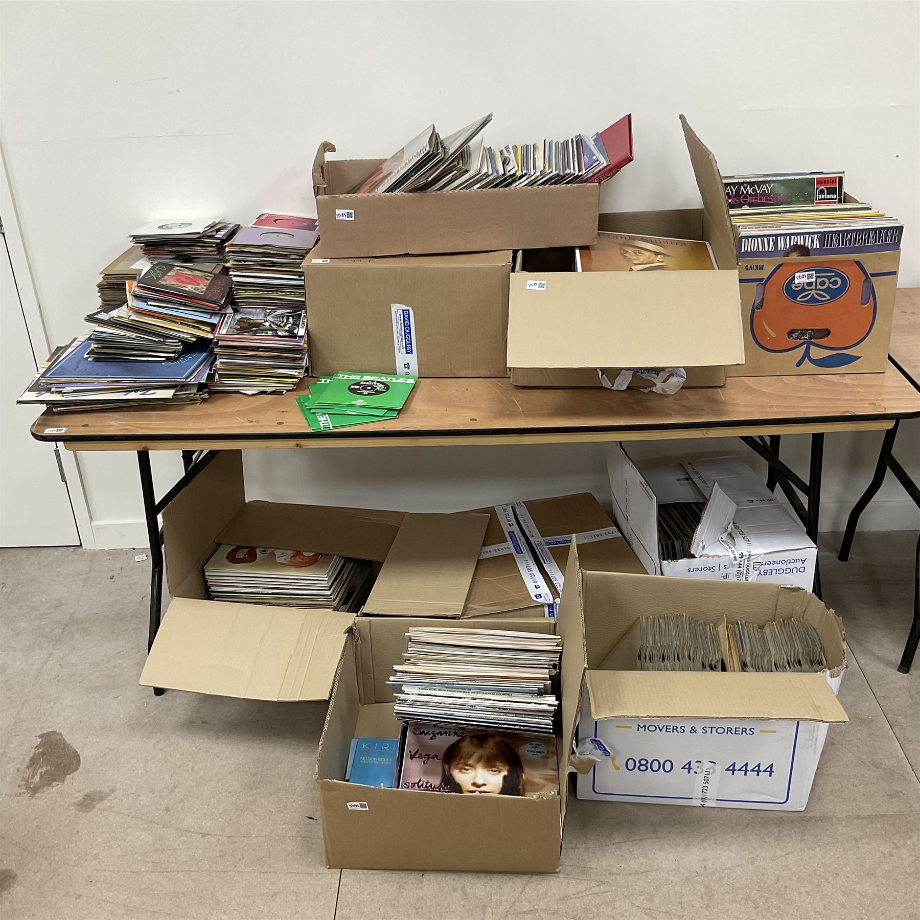 Large quantity of vinyl LPs to include Madonna, ABBA, The Carpenters etc, together with a quantity of 45rpm records, to include approx nine The Beatles The Singles Collection examples etc