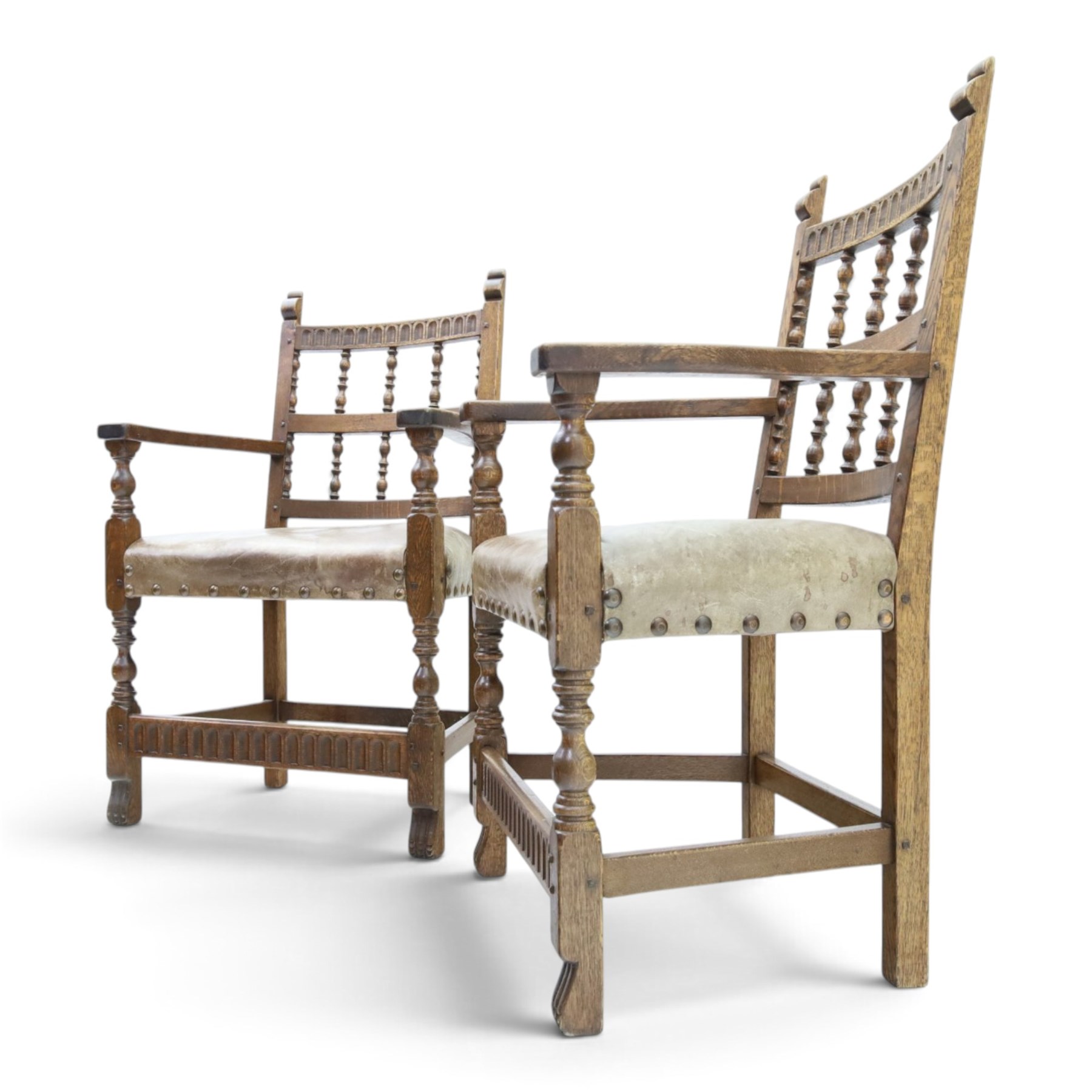 Rupert Griffiths for Monastic Woodcraft - oak 6ft refectory dining table with set six (4+2) matching chairs, rectangular top with arcaded frieze, with trestle base with further arcaded carved stretchers, chairs with carved rails and finials, leather wrapped seats with stud detail, turned supports united by carved stretcher