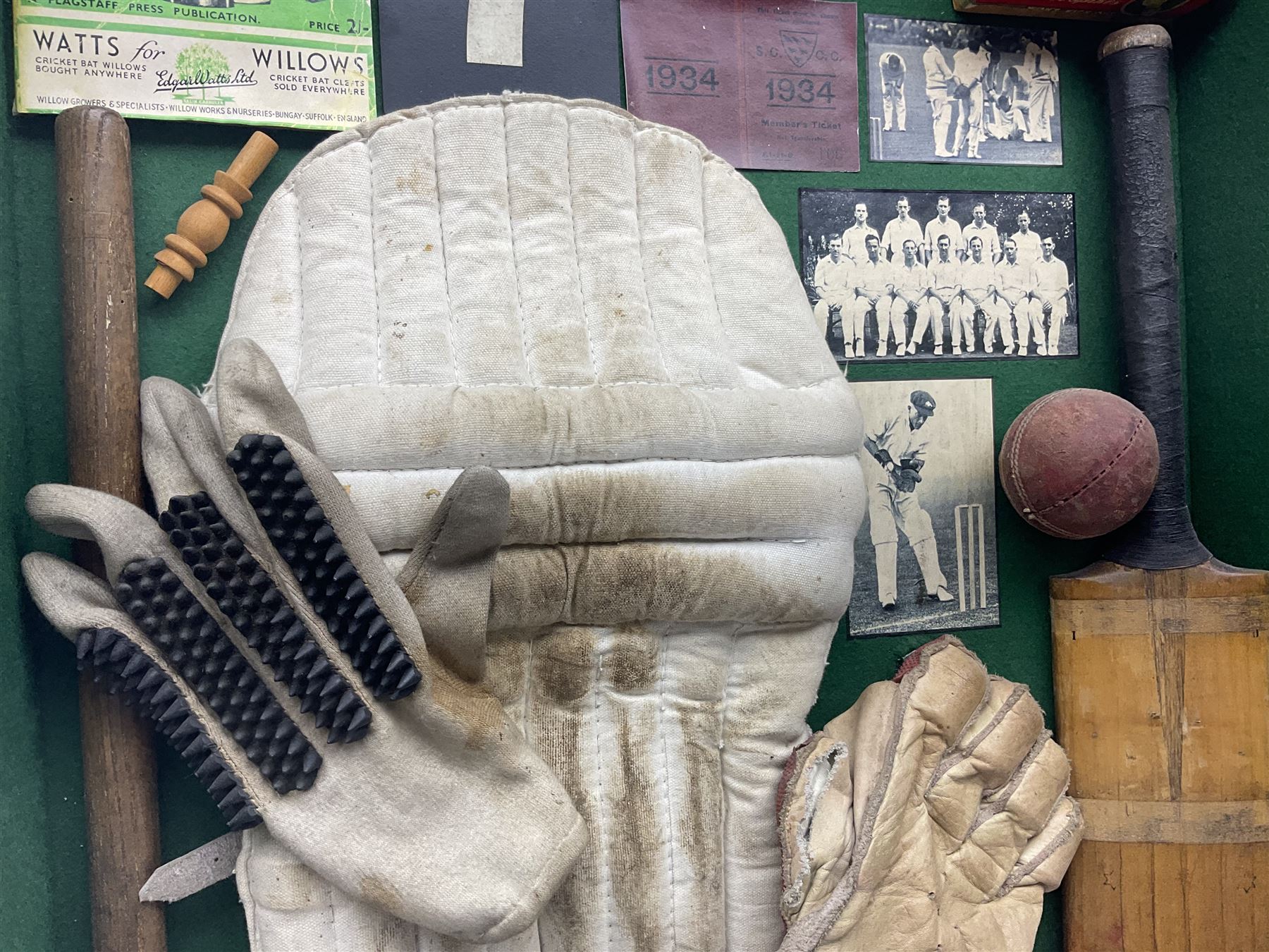 Four framed sporting memorabilia displays, the largest example containing 1930s cricket memorabilia, together with two fishing displays and a football display, each within wooden glazed frames, largest H105cm