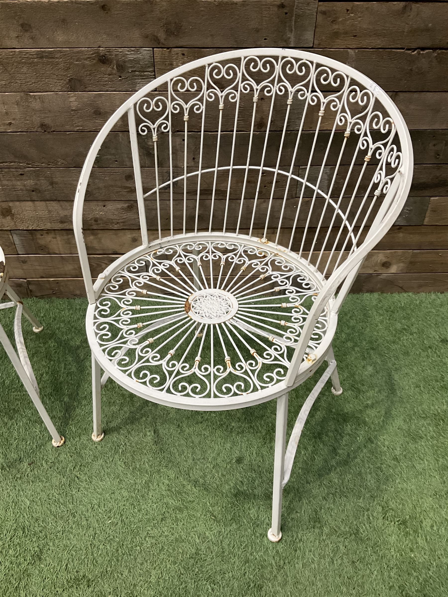 Pair of wrought metal white painted wirework garden chairs - THIS LOT IS TO BE COLLECTED BY APPOINTMENT FROM DUGGLEBY STORAGE, GREAT HILL, EASTFIELD, SCARBOROUGH, YO11 3TX