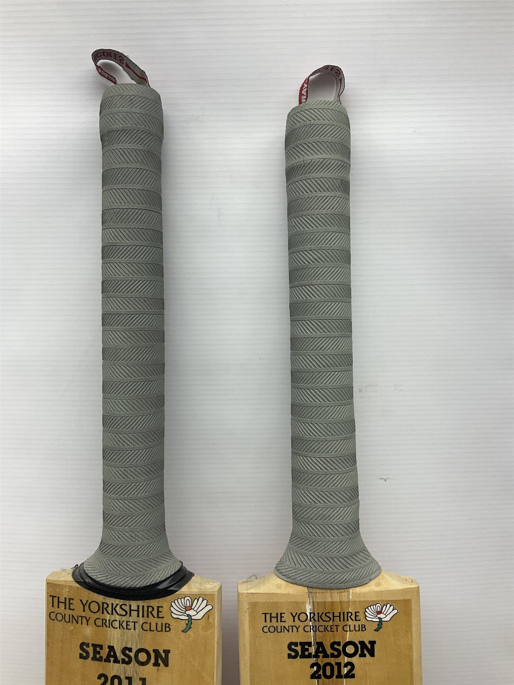 Two signed Yorkshire County cricket bats, from 2011 and 2012 seasons, bearing signatures including Adil Rashid, Andrew Gale, Ryan Sidebottom, Gary Ballance etc