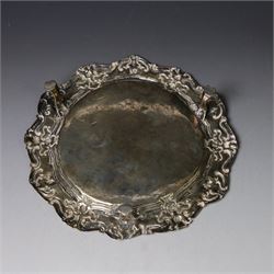 19th century continental silver waiter, of hexagonal form with stipple and scroll border, engraved with floral decoration to centre, upon three stylised paw feet, W19.2cm