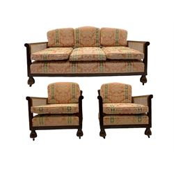 Early 20th century walnut framed three piece bergère lounge suite - two seat settee (W162cm), pair armchairs (W73cm)