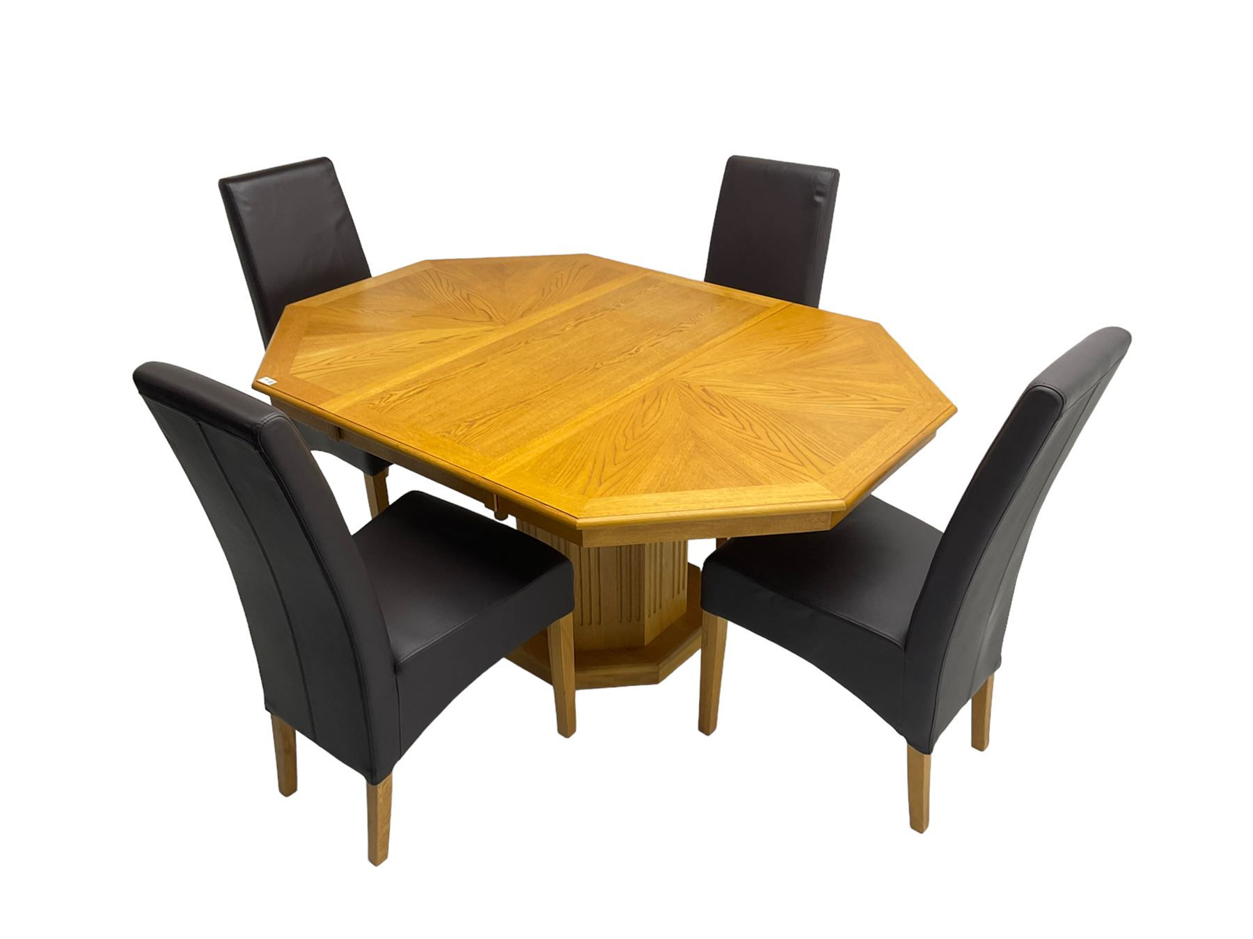 Oak octagonal extending dining table with additional leaf, octagonal pedestal base with fluting (150cm x 105cm x 76cm), and set four high back dining chairs upholstered in chocolate brown faux leather on square tapering supports (47cm x 54cm x 102cm)