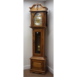  Emperor three chime light oak longcase clock, triple weight movement chiming the quarter hours on rods, swan necked pediment and glazed door, with instructions, H215cm  