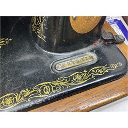 No.99 Singer sewing machine in case, with book, accessories, serial no EF 229971, 1949