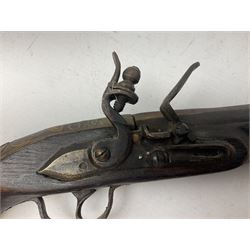 Reproduction flintlock pistol, the full walnut stock with brass filigree inlay and mounts and skull crusher butt L46cm; no visible proof marks FIREARMS CERTIFICATE REQUIRED OR RFD