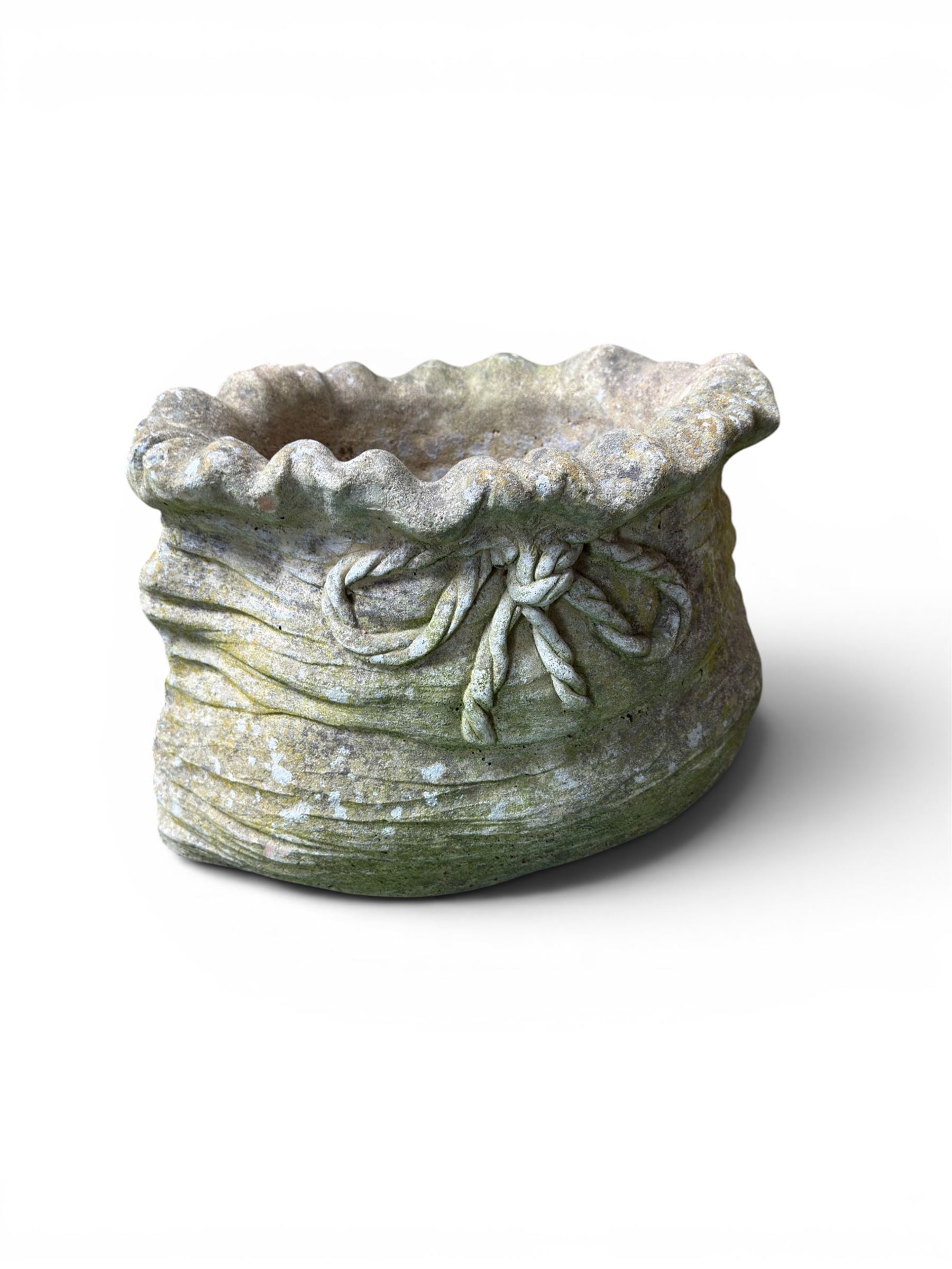 Four cast stone garden planters in the form of ribbon tied planting sacks