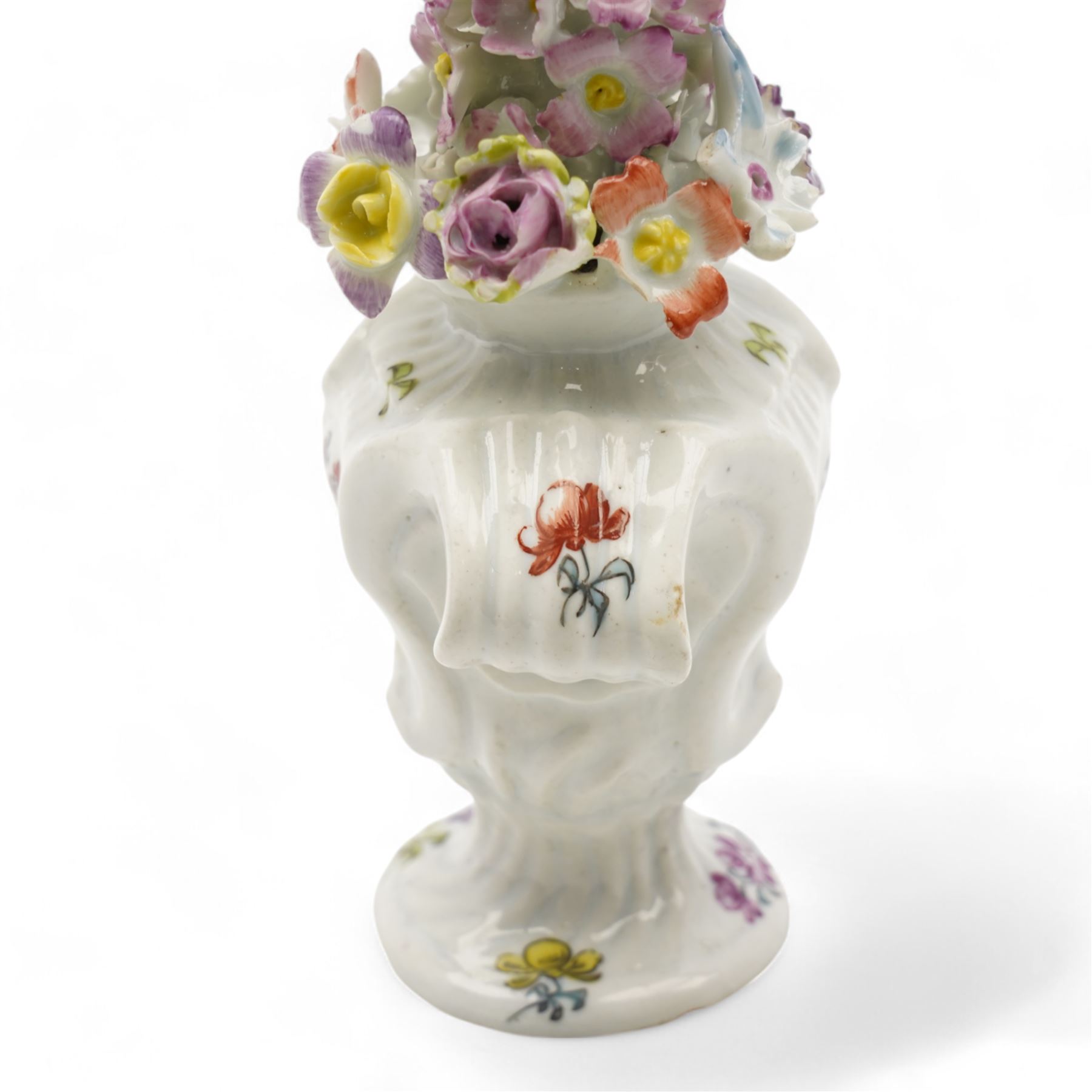 Longton Hall floral table ornament, circa 1755, the moulded rococo base painted with floral sprays and sprigs, below a floral encrusted arrangement, unmarked, H14.5cm 