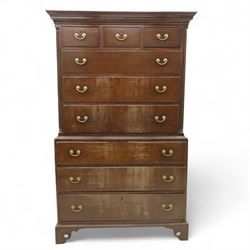 Mid 18th century oak tallboy chest, the projecting cavetto-moulded cornice over two short and three long drawers to the upper section, the lower section with three further graduated long drawers, each drawer with oak linings and fitted with later brass swan-neck handles, flanked by stop-fluted quarter columns, all raised on shaped bracket feet
