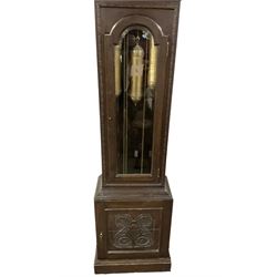 German - 8-day oak longcase clock c1910, with a carved case, swan necked pediment and fully glazed trunk door, brass dial with a silvered chapter ring with Roman numerals, minute track and silvered 