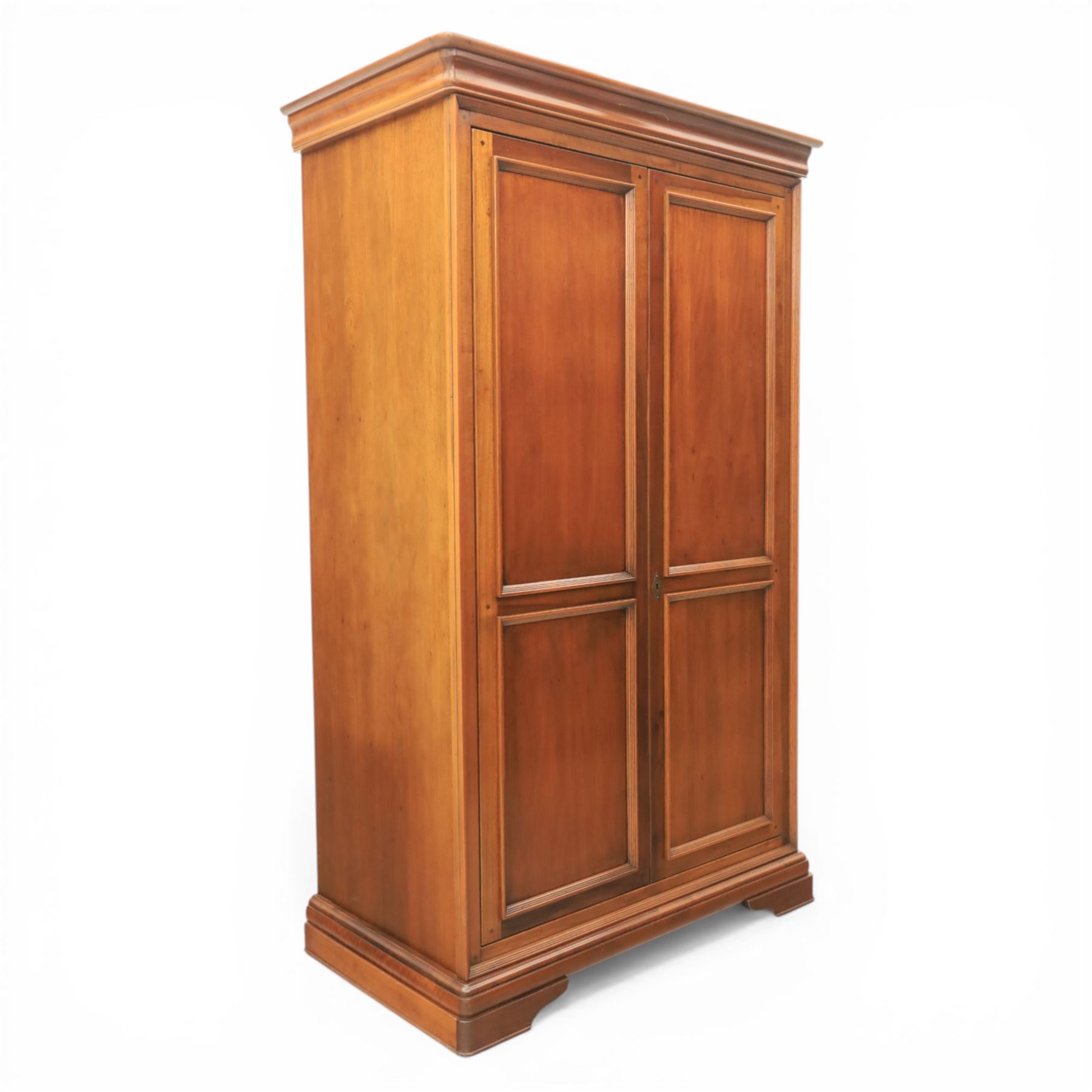 Willis & Gambier - French cherry double wardrobe, moulded cornice above panelled doors, enclosing a shelf and wooden hanging rail, raised on a moulded plinth with bracket feet