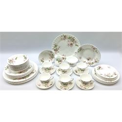 Wedgwood Apple Blossom pattern dinner and tea wares, comprising six dinner plates, six side plates, six bowls, nine smaller bowls, six tea cups and six saucers, milk jug and open sucrier. 