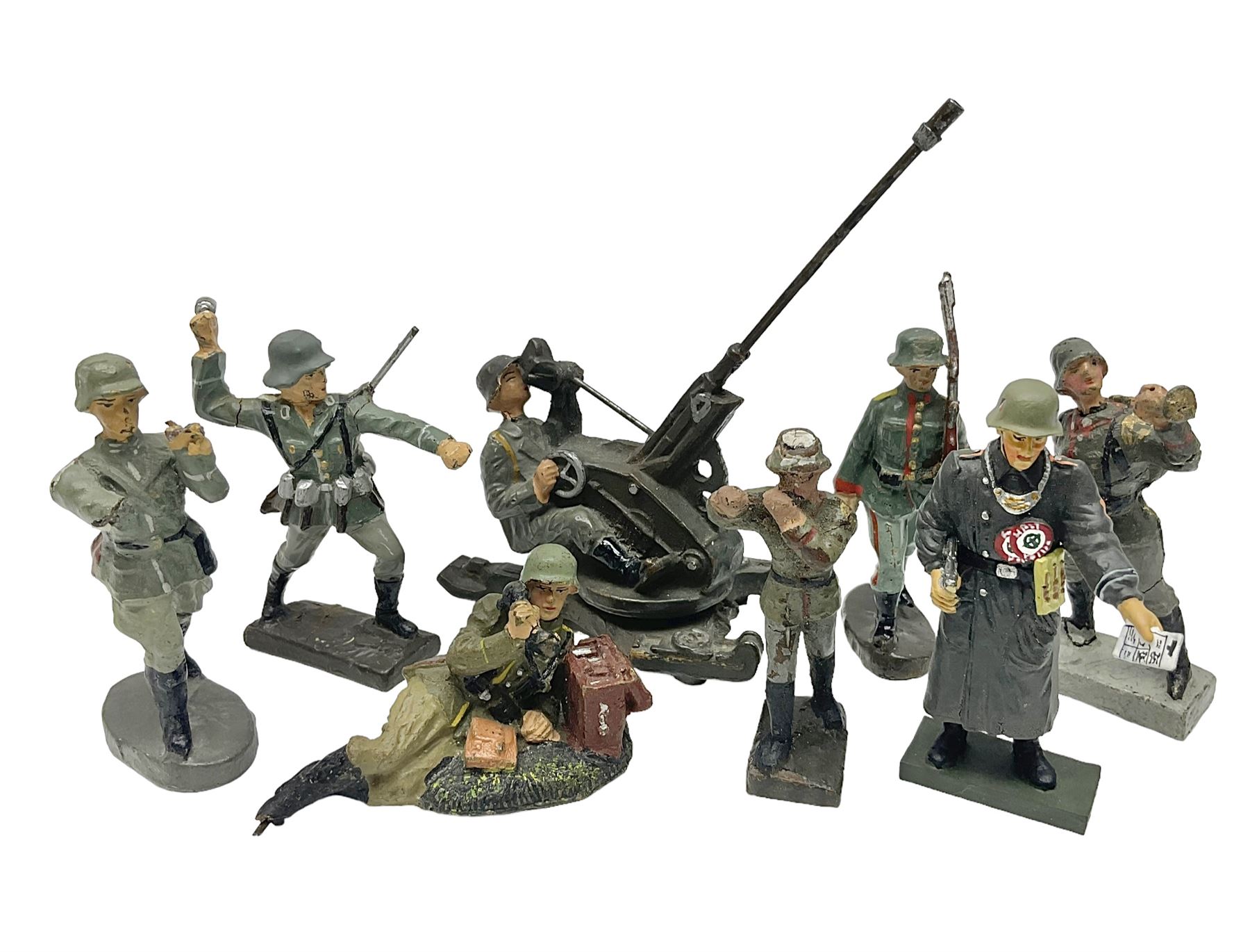 German Lineol Flak Artillery Gun on revolving base H11cm; four other Lineol WW2 German soldiers; and three Elastolin German soldiers including reclining radio operator (8)