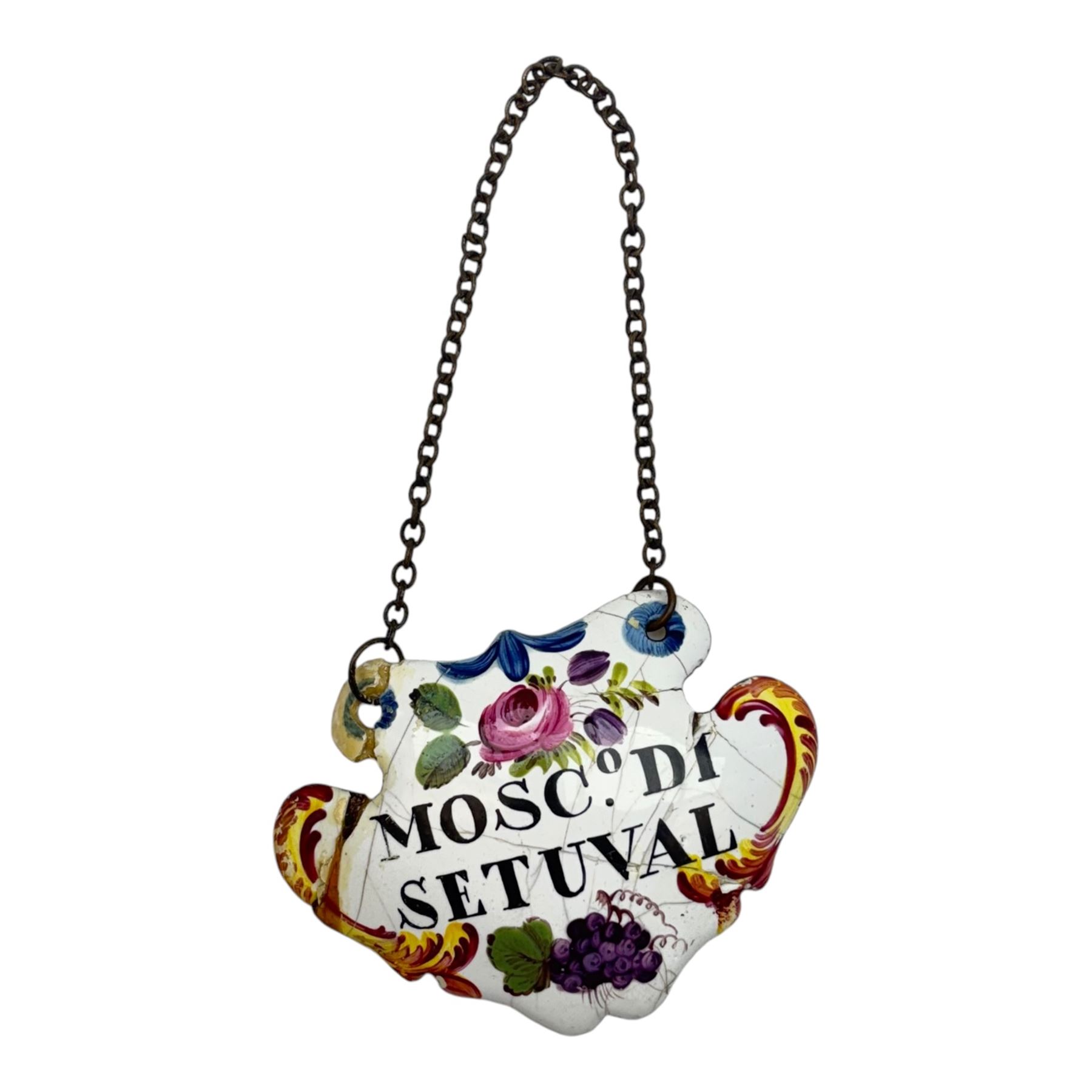 Seventeen mid 18th century and later enamel wine labels, one example of heart shaped form, the rest of cartouche and escutcheon form, various titles including Claret, Rum, Sloe Gin, Port, Whisky, Cowslip, Cherry-Brandy, etc., largest example W7cm 