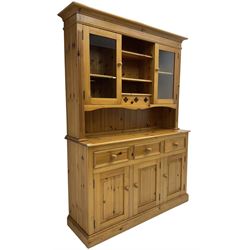 Traditional pine dresser, the rack fitted with two shelves flanked by glazed cupboards, the base with three drawers over three panelled cupboards