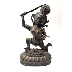 An eastern figure bronzed figure modelled as female deity  kneeling upon figure, upon stylised lotus base, H28cm