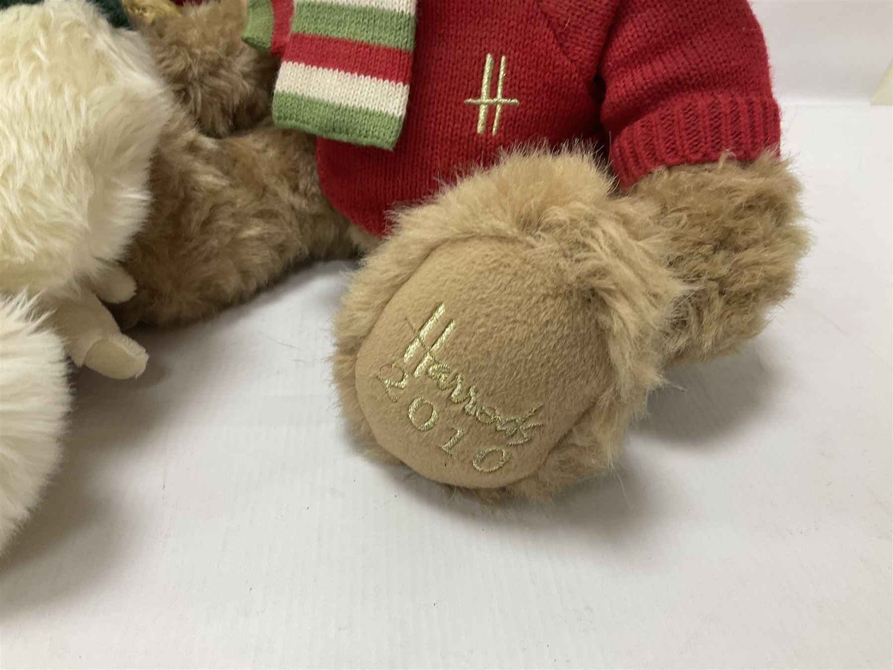 Six Harrods annual teddy bears, dating between 2005 and 2010, including 20th anniversary edition bear, tallest H39cm