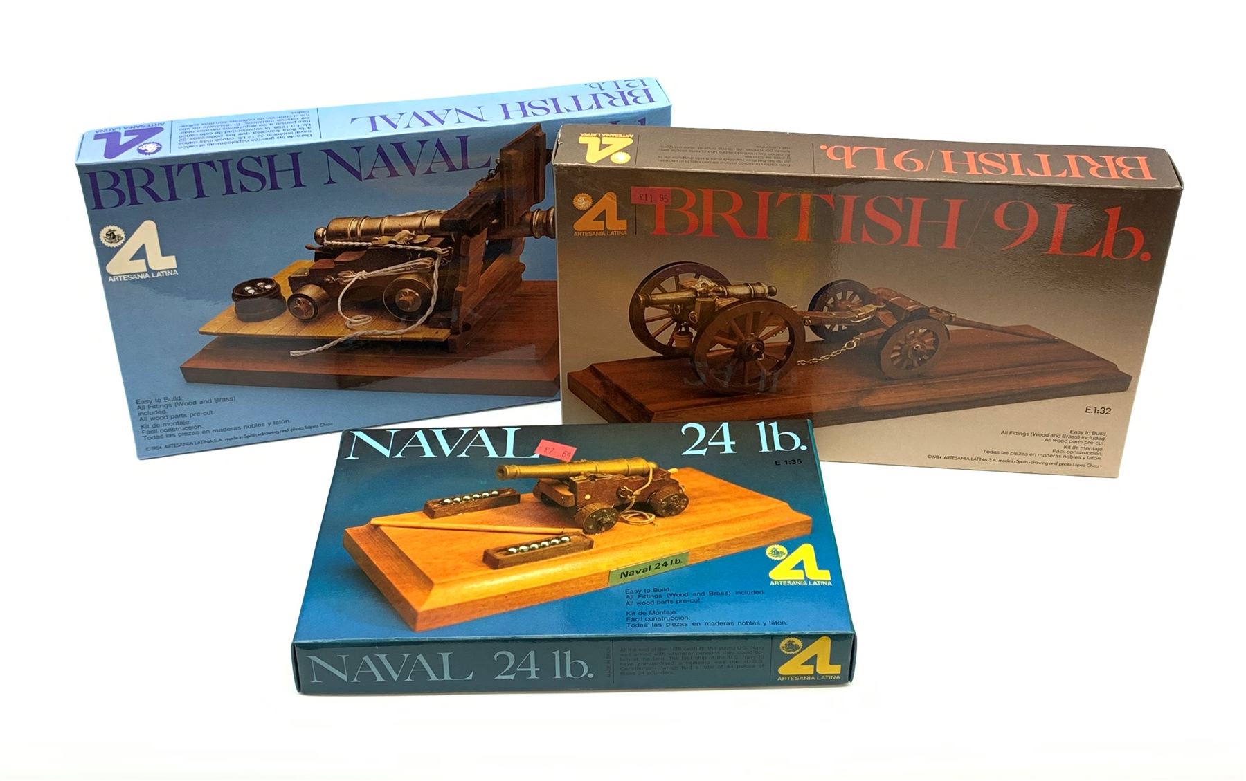 Three Artesania Latina wood and brass model kits of cannons including British 9lb, Naval 24lb and British Naval 12lb; all boxed with instructions and components in factory sealed transparent packaging (3)