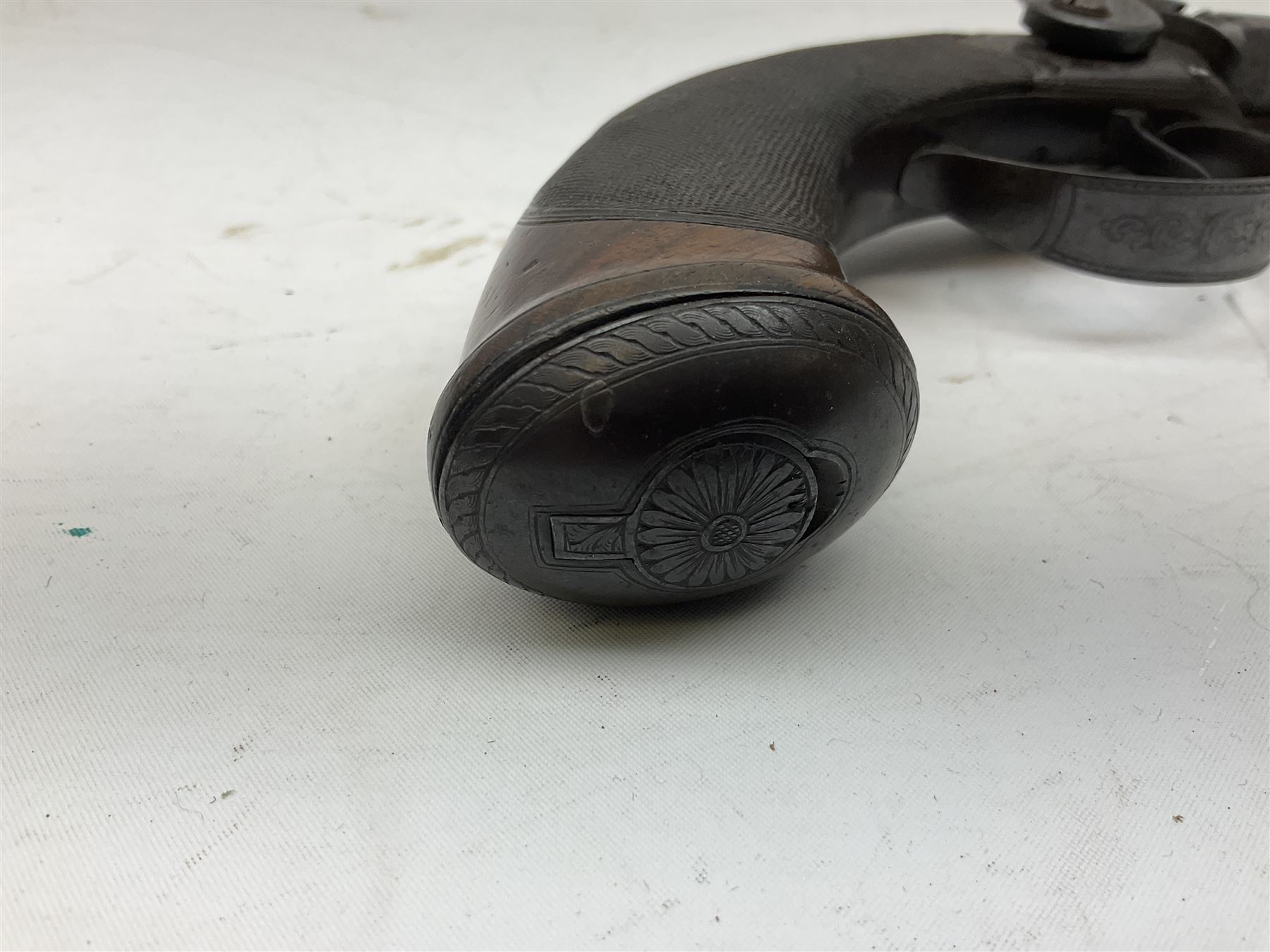 Early 19c percussion double barrel Howdah pistol by J. Blisset London, c1840s, approximately 50 calibre, 10.5cm octagonal monobloc barrels with captive swivel ramrod under, finely chequered walnut stock, engraved hammers, lock plates, tang and trigger guard, butt plate with hinged cap compartment, vacant white metal oval escutcheon L25.5cm overall