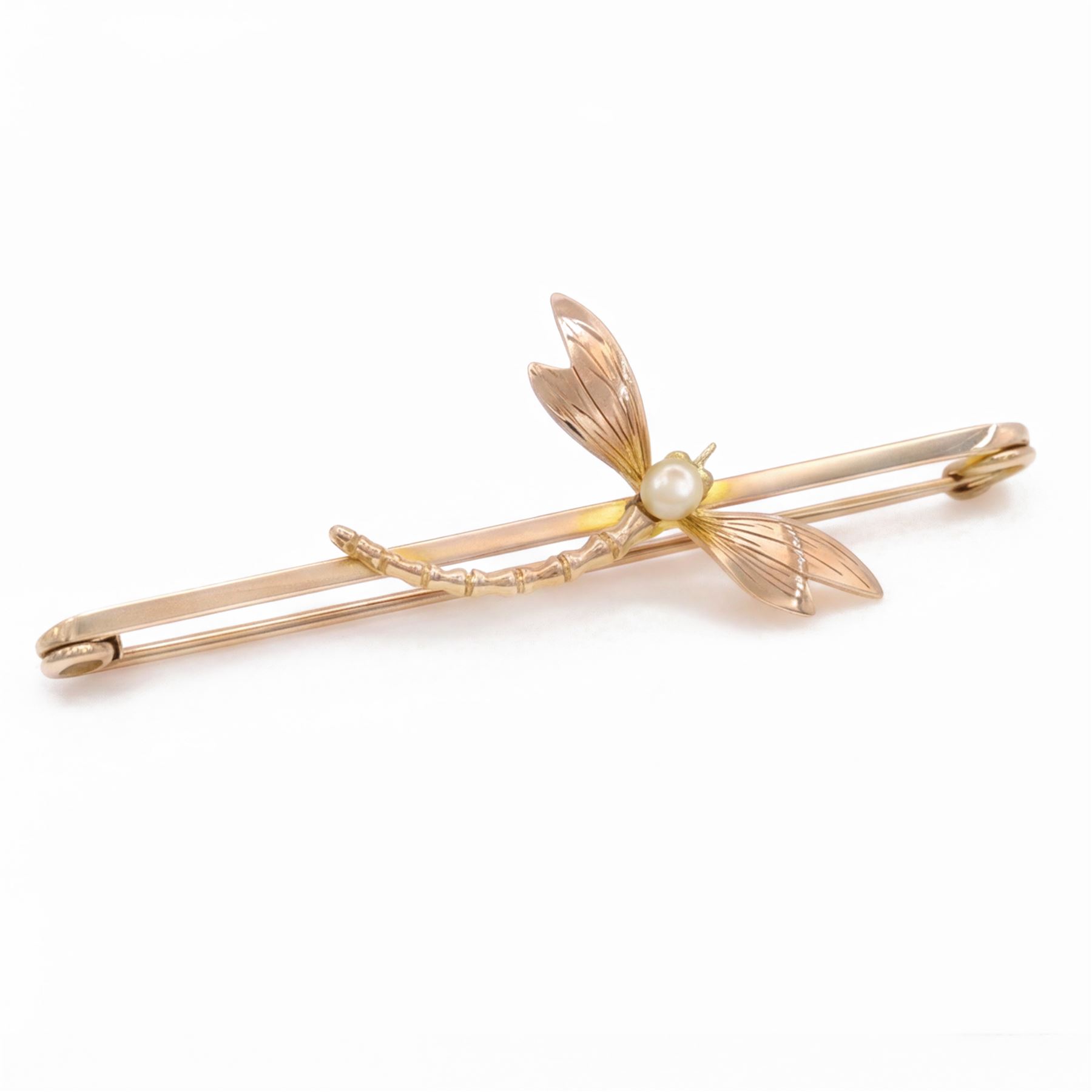 Early 20th century rose gold dragonfly bar brooch, set with a single white / cream pearl, stamped 9ct