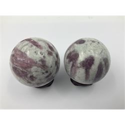 Pair of pink tourmaline spheres, upon gilt metal stands, H9cm D5cm