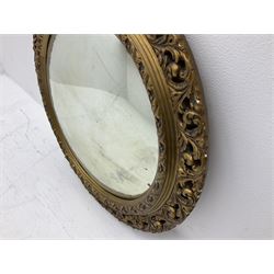 Gilt circular convex wall mirror, D61cm and a gilt chandelier
