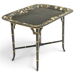 Victorian ebonised and gilt-painted papier-mâché tray on later ebonised and parcel-gilt simulated bamboo stand, the rectangular removable tray with gilt foliate and butterfly scenes with scrolling branches, the base on four ring-turned and splayed supports united by X-stretcher