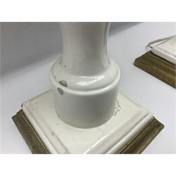 Pair of Casa Pupo white-glazed table lamps, modelled as a fruit upon a column of baluster form with foliate decoration, on a giltwood base, H62cm