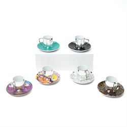 Damien Hirst (British 1965-); set of six anamorphic silver lustre espresso cups and saucer...
