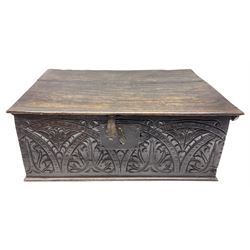 17th century oak bible box, the hinged lid over front carved with arched lunettes and foliate motifs, fitted with iron lock, H22cm W59cm D38cm