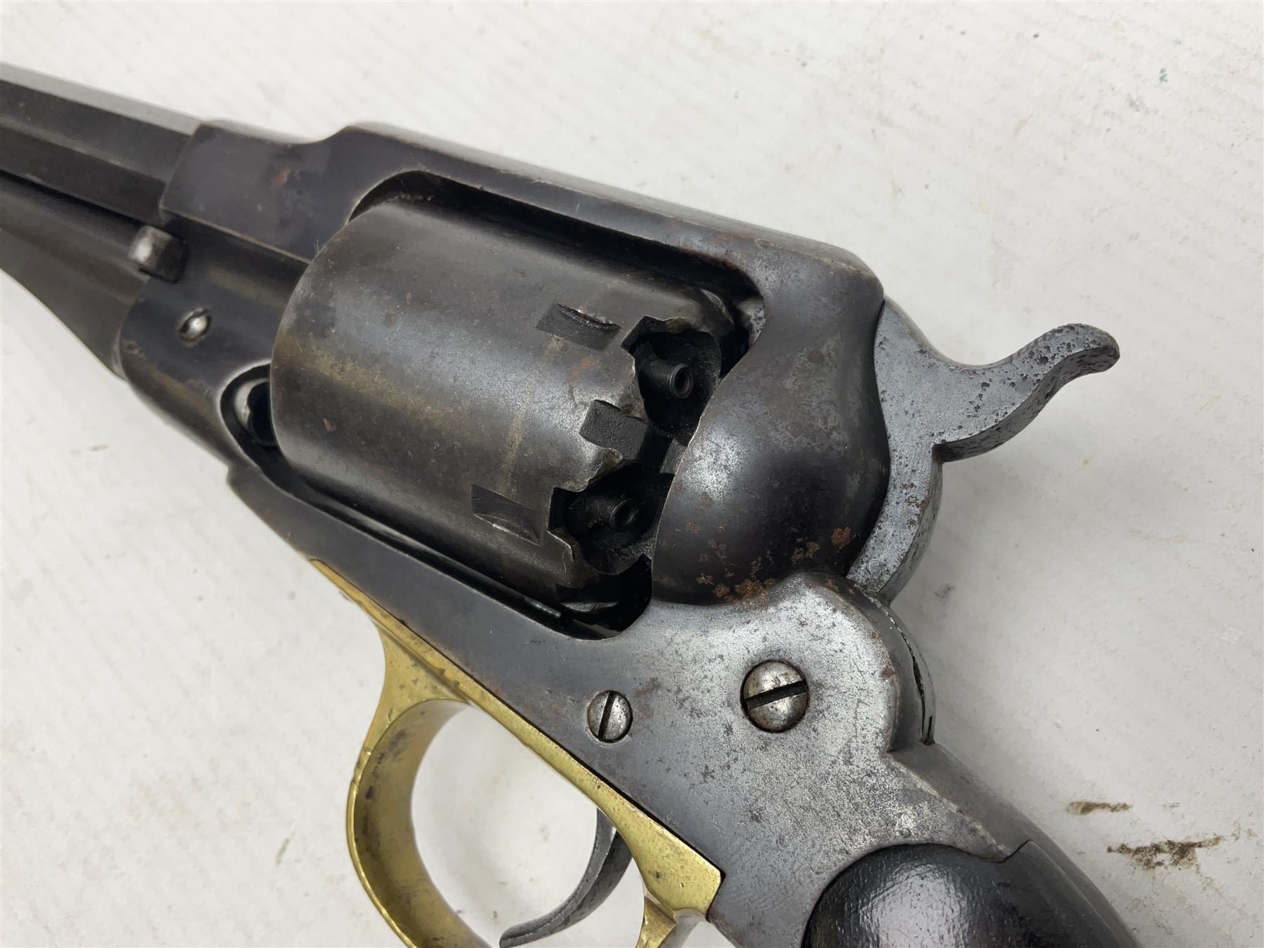 Unmarked Spencer & Rogers type Remington style .44 cal. six-shot percussion revolver, 20cm octagonal barrel with loading lever under, brass trigger guard and two-piece wooden grip L37cm overall; together with a framed watercolour by Alan J. Gray dated 2009 entitled 'The Remington .44 Calibre 1861 Navy Revolver'  19 x 42cm (2)