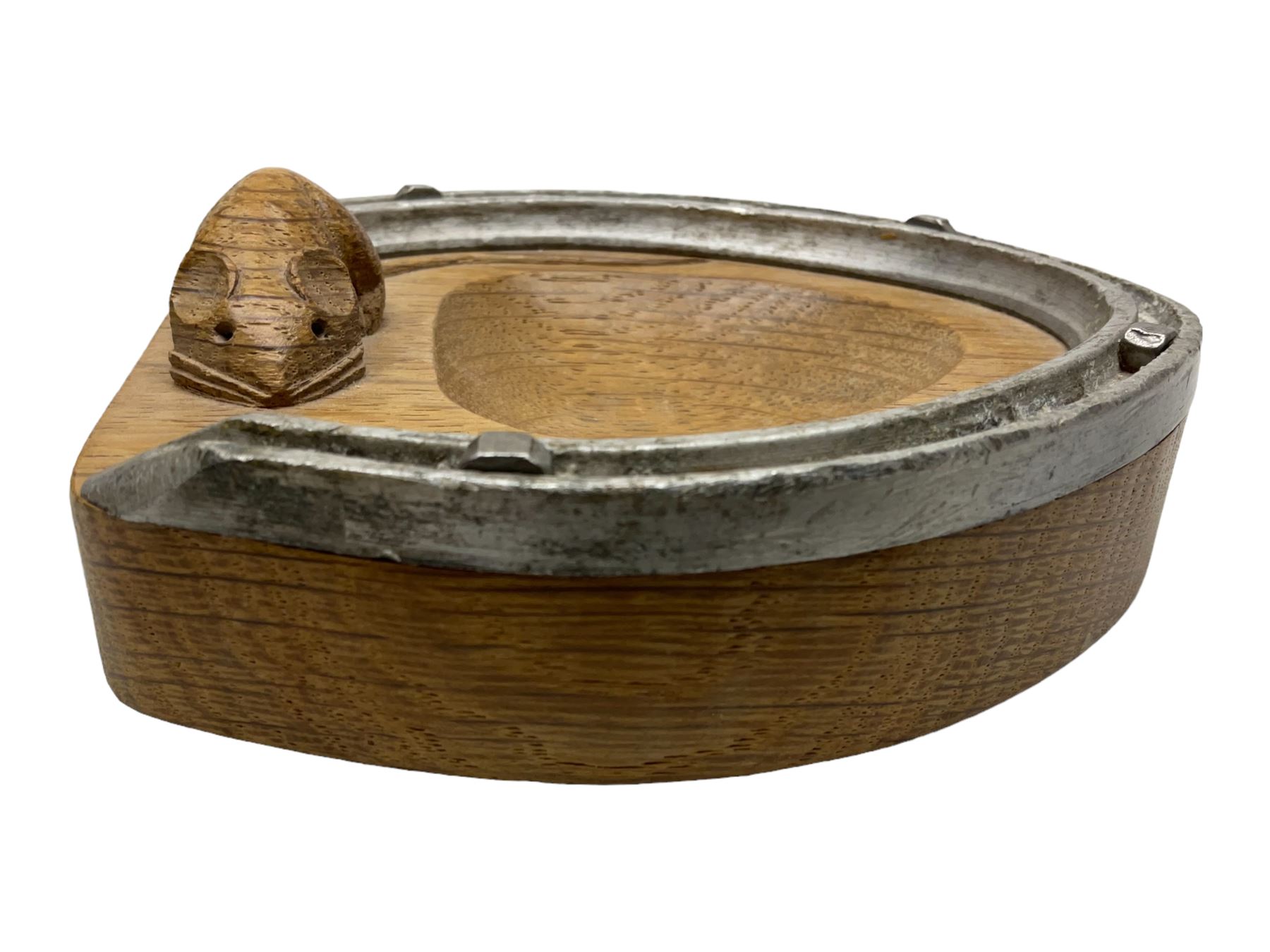 Mouseman - oak horseshoe ashtray, rounded triangular form with mounted horseshoe, carved with mouse signature, by the workshop of Robert Thompson, Kilburn, L13cm