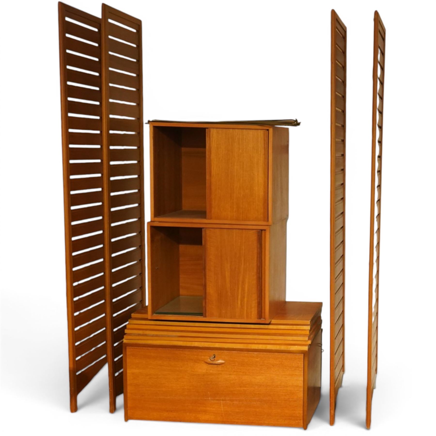 Ladderax - mid 20th century teak modular wall unit, comprising two sliding door cabinets, one fall-front cabinet, six shelves, four ladder supports and fourteen metal cross braces