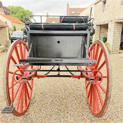 Holland & Holland Tandem Cart - Althorp Spencer Family Estate

A two wheeled tandem cart or cocking cart by Holland & Holland Coach Builders, London, with black painted bodywork, red painted shafts and running gear, red wooden spoked wheels with rubber tyres, green upholstered seating and a rear perforated metal footboard. The cart is fitted with carriage lamp brackets (lamps next lot), green buttoned cushions with leather retaining straps, side louvered body panels, footrests, leaf spring suspension and shafts for horse use. The carriage incorporates an adjustable body position, operated by a lever, allowing the body to be moved forwards or backwards to alter the weight distribution. Formerly owned by the family of Lady Diana Spencer,
Sympathetically conserved by Woods of Fairbourne Carriages Ltd, Kent.

Features:
• Brass maker’s plaque for Holland & Holland Coach Builders, London
• Two wheeled tandem cart
• Black painted body with red painted shafts and running gear
• Red wooden spoked wheels with rubber tyres
• Green upholstered cushions with leather retaining straps
• Adjustable carriage body for weight distribution
• Lever operated adjustment mechanism
• Perforated rear footboard
• Side footrests
• Louvered side panels
• Leaf spring suspension
• Rear opening storage compartment
• Decorative painted armorial motif to rear panel
• Fitted carriage lamps shown, not included in the lot (available as next lot)
• Conserved by Fairbourne Carriages Ltd
• Provenance: The Althorp Attic Sale including The Spencer Carriages, lot 195, 7 July 2010

Dimensions:
Overall length 396 / 198cm
Width 155cm
Height 190cm

Wheel Diameters:
Wheels: 148cm

Seating:
Driving seats: 2
Passenger seats: 2