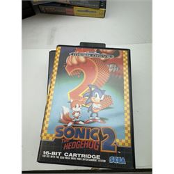 Eighteen Sega Mega Drive games, including Sonic The Hedgehog, Sonic The Hedgehog 2, Alienstorm, Desert Strike, Fatal Rewind, Road Rash etc, all boxed, together with a Sega Mega Drive controller, cartridge converter and an arcade power stick controller